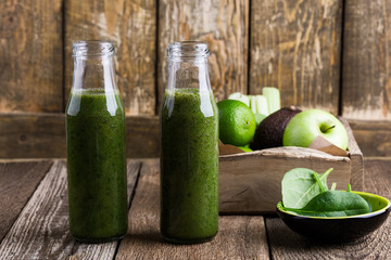 Healthy green fruits and vegetables smoothie, spinach, avocado, apple, celery and lime juice drink