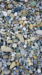 pebbles on the beach, rubble on the seashore, top view