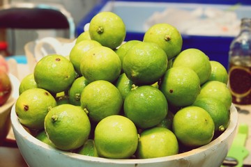 Fresh Green Lemon in the market close up