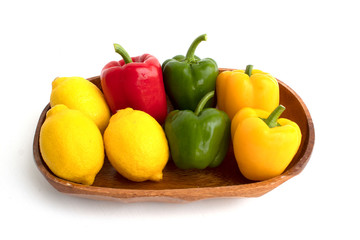 colerful bell peppers and lemon on white background