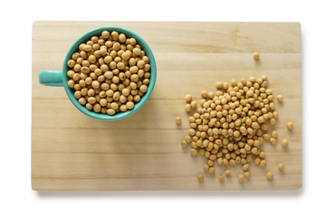 Soybean in a cup on the wooden tray