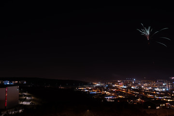 Long exposure of fireworks during new years eve over Reykjavik city in Iceland