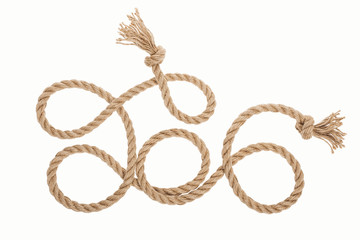 long brown jute rope with knots and curls isolated on white