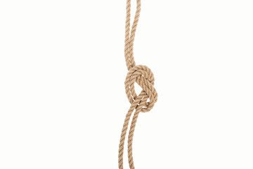 nautical brown ropes with sea knot isolated on white