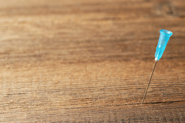 Medical needle from a syringe close-up