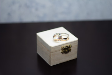 Wedding gold rings in a wooden box