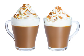 Cappuccino coffee with whipped cream and cinnamon in a glass mug. The photo.