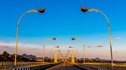 Night light of the bridge with blue sky, Bridge over the Mekong River, nakhon phanom Thailand