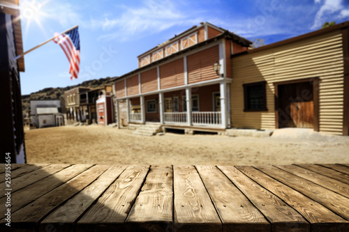 Wooden old table background and American city background