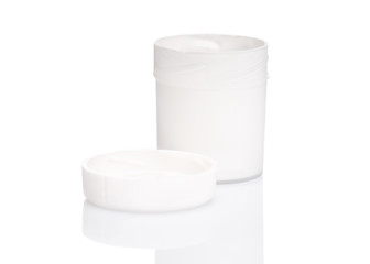 Opened white Gouache jar, isolated on white background with copy space. Cans of different colors gouache paints.