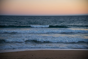 Atlantic ocean, front view of waves on the beach on sunset, Bretagne