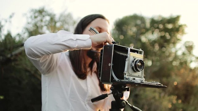 Photographer customizes large format camera before shooting