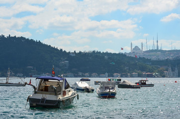 Fototapeta premium Small motoboats on the Bosphorus on a clear summer day. Istanbul, Turkey