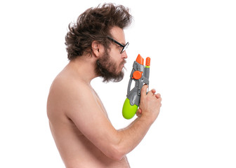 Crazy bearded Man with funny Haircut in eyeglasses, ready for fun at sunny beach. Happy and silly...