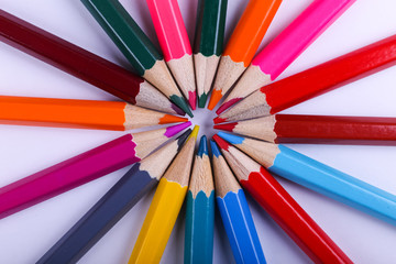 Colored pencils, on white background, pattern, copy space.