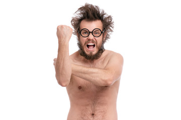 Fototapeta premium Crazy bearded Angry Man with funny Haircut in Eyeglasses Screaming and making Bad gesture. Naked guy, isolated on white background.