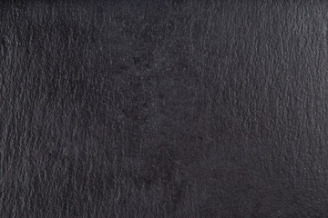 Cheese basalt stone board, cheese stand, slate platter.  Black stone slate, close up.