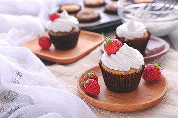 Cupcake with protein cream and strawberries.