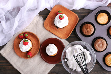 Fototapeta na wymiar Cupcake with protein cream and strawberries.