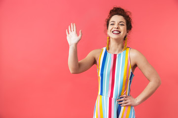 Portrait of a cheerful young woman wearing dress