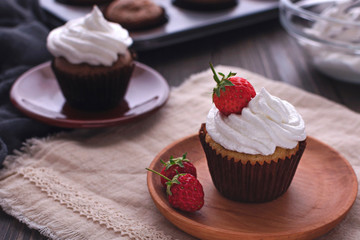 Cupcake with protein cream and strawberries.