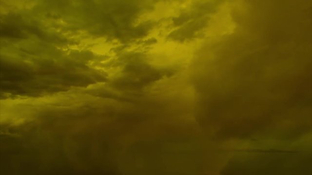 Cinematic storm clouds with lightning strikes reflecting