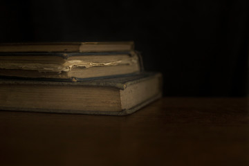 old books on wooden table