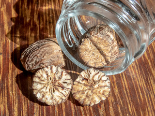 nutmeg spice isolated on the wooden background