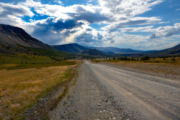 Fototapeta premium Mountain road spring ranges landscape. Mountain hill road panorama