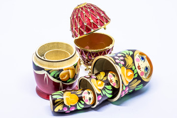 Matryoshka family. Matrioska art Russian doll and Russian souvenir, egg casket copy of Faberge on a White background