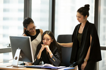Successful team at work. Group of young business people working and communicating together in creative office