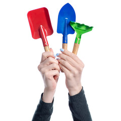 Set of garden rake and shovel in hand on white background isolation