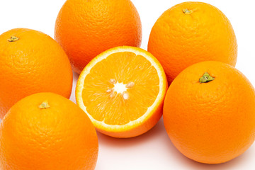 oranges and sliced orange on white background