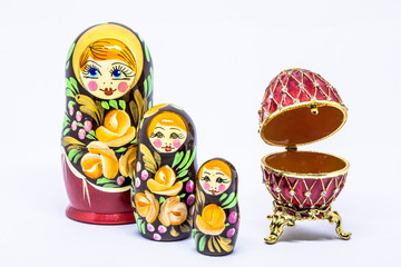 Matryoshka family. Matrioska art Russian doll and Russian souvenir, egg casket copy of Faberge on a White background