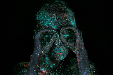 Close up UV body art alien outer space portrait 