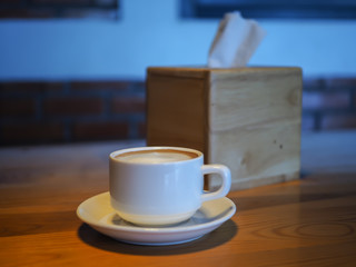 cup of coffee on wooden table