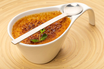 bowl of creme brule on wooden table