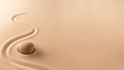 Spa wellness background of a zen meditation garden with sand and round stone. A nice curved line on sandy texture. Lots of copy space. - obrazy, fototapety, plakaty