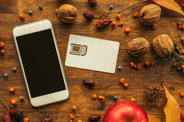 Modern smartphone with sim card, flat lay top view