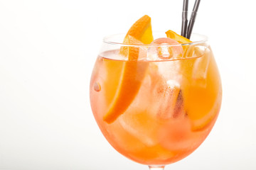 glass of aperol spritz cocktail on white background