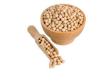 Yellow pea in wooden bowl and scoop isolated on white background. nutrition. bio. natural food ingredient.