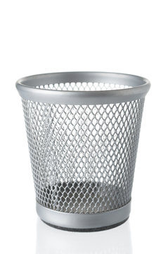 Empty garbage bin close up isolated on white background