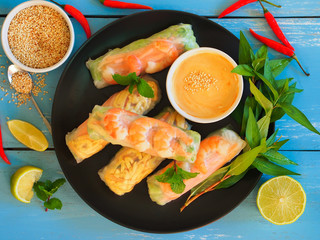 Fresh summer rolls with shrimp and vegetables, Vietnamese food in top view for healthy food concept.