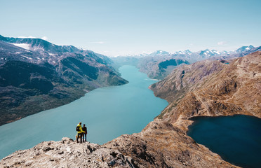 Couple enjoy the view at the norwegian landscape