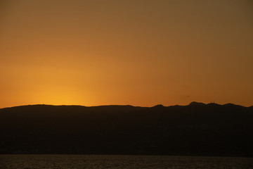 Rock groyne at sunset, Crete, Greece