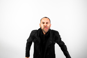 Obraz premium Middle-aged man in black coat making obscene gestures