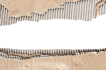 Brown corrugated texture paper torn on white background. rip of cardboard sheet used as a...