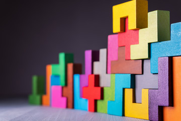 Geometric shapes on a wooden background.