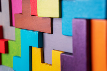 Geometric shapes on a wooden background.