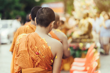 Group of Monks bath Buddha sculputer purify body and spirit in Songkran festival, Thailand